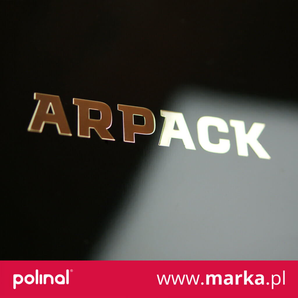 złote logo chromowane firmy arpack